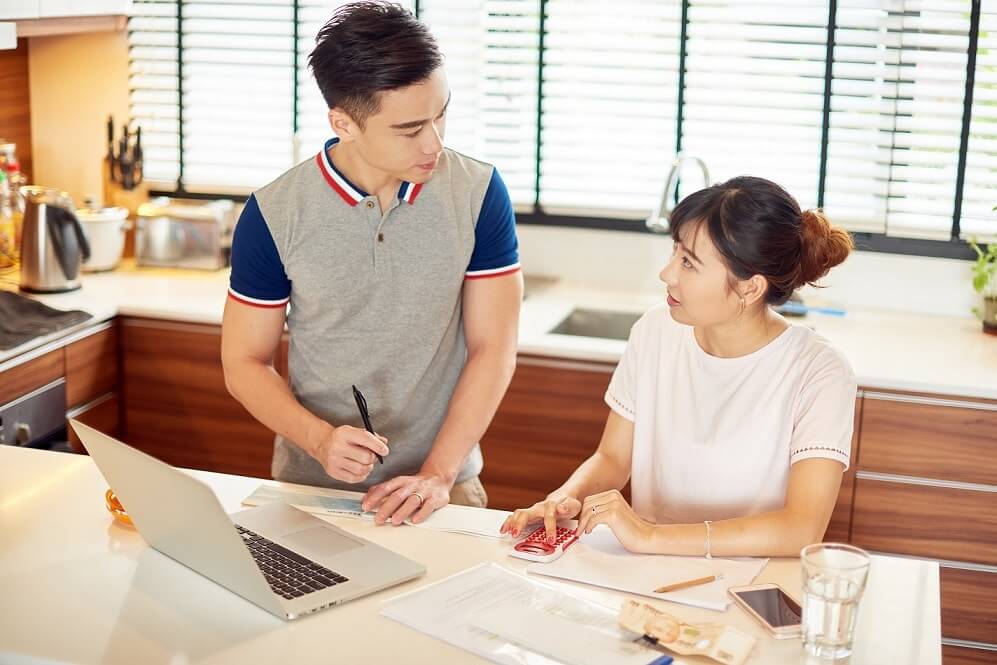 husband discussing with wife about insurance
