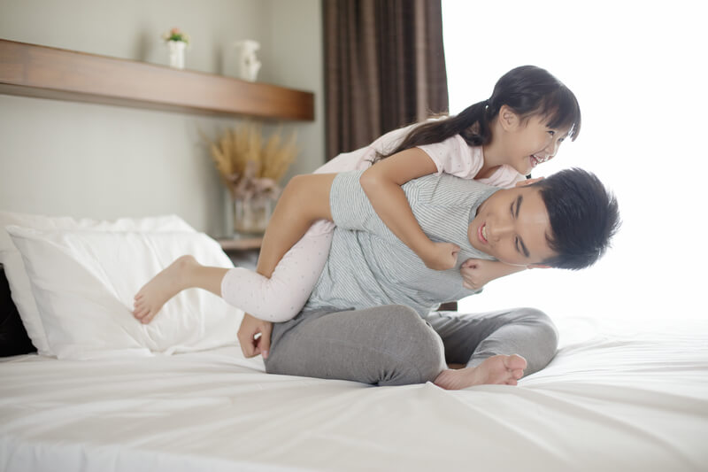 How to manage time better – dad giving daughter piggyback ride